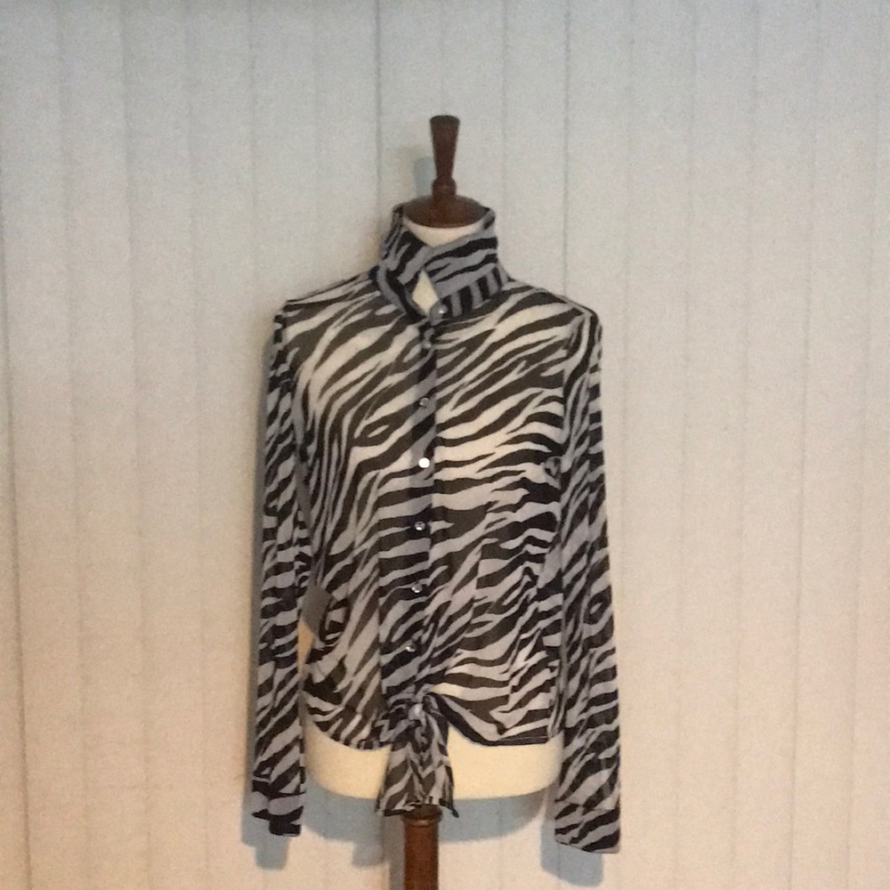 Inc black and white zebra print top.